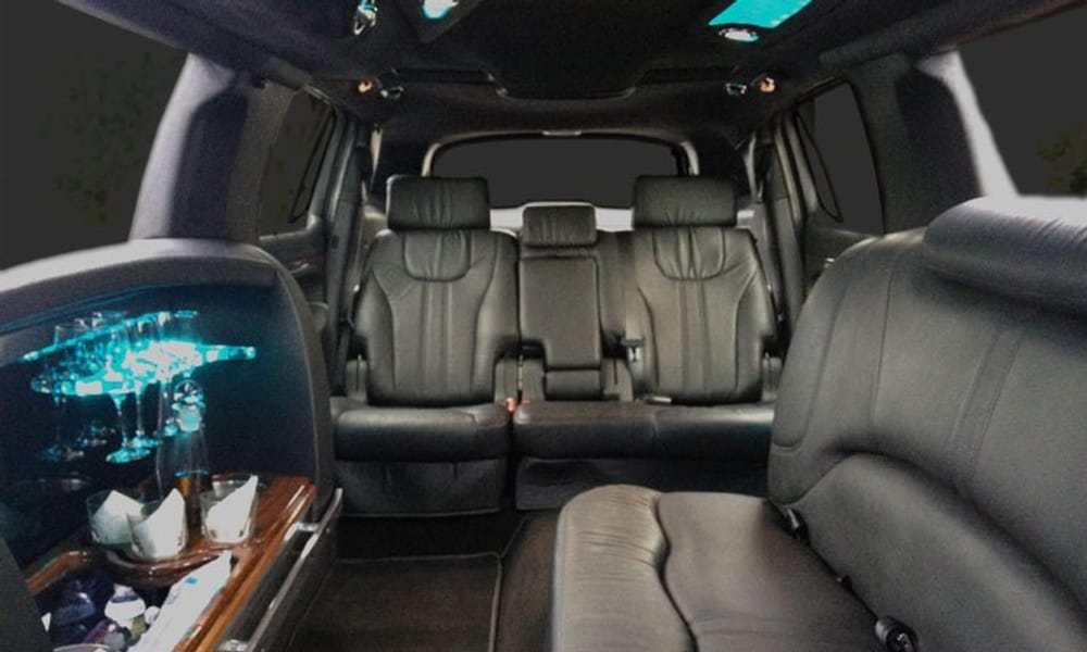 Lincoln MKT stretch limousine rear cabin with wet bar, glassware and mood lighting