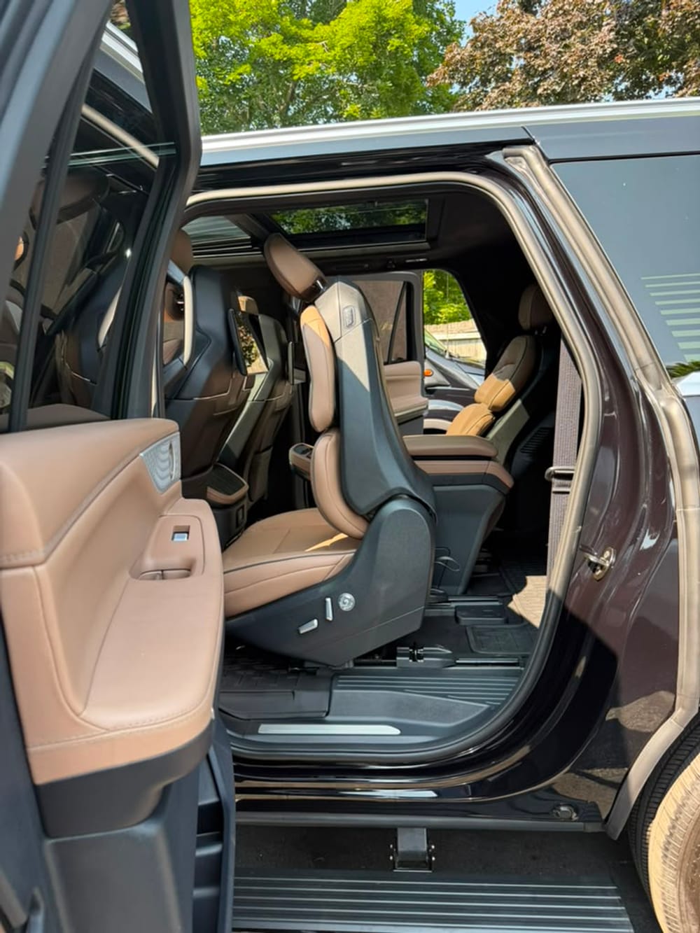 Lincoln Navigator SUV limo second row captain's chair with sunroof, door open